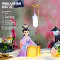 Ancient style girl night light in purple hanfu playing chess made of resin - Playing Chess Under Lamp (1060-37)