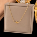 Elegant gold-tone knot pendant necklace made of stainless steel displayed in a luxury box - XLH1141 Knot / Gold