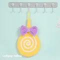 Absorbent yellow lollipop hand towel in coral fleece with purple bow and hanging loop - Lollipop Style / Yellow