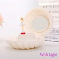 Elegant white shell music box with a rotating ballerina figurine and interior mirror - By999 White Seashell With Lights / Music Boxes