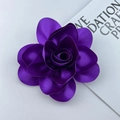 Detailed macro view of a 14cm purple satin flower brooch with handmade layered petals - Deep purple