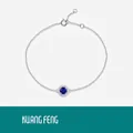 Bracciale in argento S925 con zaffiro blu rotondo, incastonatura halo e catena regolabile - Bracciale Colore Zaffiro 50 Punti