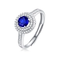 Elegant adjustable silver ring featuring a round blue sapphire with white zircon halo - 50 Points Sapphire Color Ring
