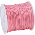 Pink silk-finish braided cord on white spool for DIY bracelet and jewelry making - Watermelon red
