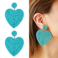 Bohemian turquoise heart handmade beaded earrings shown on model and white background - Turquoise (NXE05931-6)