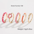 Five-piece gold rings set featuring pink and orange enamel hearts and XOXO letters - Five-Piece Collection (DNXS01319G17) / No. 17