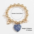 Golden beaded bracelet with a blue marble heart pendant and white pearl accents - Blue Stone Heart Style (WXB01181)