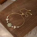 Bracciale regolabile placcato oro con cuore, pietra verde e dettagli in zirconi - Oro (SL89876)