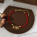 Detail of red woven zodiac horse bracelet with gold horse charm and adjustable slider - Pave Rocking Horse Disc Style (SL90328)