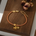 Detail of red braided rope bracelet with golden horse pendant and coin charms - Gold Horse Coin Transfer Bead Style (SL90343)