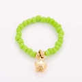 Close-up of green beads ring with gold star pendant and handmade elastic band - One Size / Green Star Style (NXR01554)