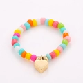 Detailed close-up of colorful seed bead ring set with a golden heart charm - One Size / Colorful Gold Heart Style (NXR01580)