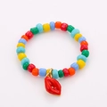 Detail of colorful beaded stacking rings featuring a vibrant red enamel lip pendant charm - One Size / Red Lips Pendant Style (NXR01561)