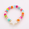 Detail of multi-layered beaded ring set with colorful candy beads and a white star charm - One Size / White Star Style (NXR01560)