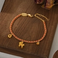 Braided red string bracelet with golden horse, coin, and flower charms for women - Pony Coin Flower Pendant Style (SL90336)