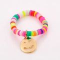 Close-up of colorful handmade beaded stretch rings with a golden smiley face charm detail - One Size / Colorful Clay Smiley Style (NXR01577)