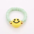 Detailed macro view of handmade colorful beaded rings with green heishi beads and smiley face - One Size / Green Soft Clay Smiley Style (NXR01556)