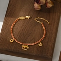 Braided red rope bracelet with golden rocking horse and coin charms for year of horse - Red String Gold Bead Rocking Horse Coin Style (SL90337)