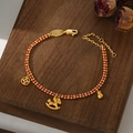 Red braided rope bracelet with golden rocking horse and money bag charms for 2026 - Pink Gemstone Horse Money Bag Style (SL90342)