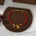 Braided red rope bracelet with Labubu pendant and gold coin charm for women - Coin Doll Pendant Labubu-look Style (SL90327)