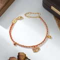 Red braided rope bracelet with golden rocking horse, heart, and fortune bag charms - Micro Drill Horse Money Bag LOVE Tag Style (SL90340)