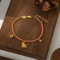 Handwoven red string bracelet with gold horse charm and ruby-set ancient coin - Ruby Coin Rocking Horse Plum Blossom Style (SL90335)