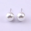 Close-up of 8mm round white glass pearl stud earrings with silver metal posts - 12mm / White (NCE07092-12MM)