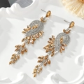Close-up of luxury champagne crystal tassel earrings with sparkling silver alloy leaf details - Champagne - Silver Base (Style 5)