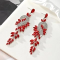 Detailed macro view of silver drop earrings with red crystals and diamond accents - Dark Red - Silver Base (Style 6)