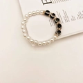 Close-up of Turkish evil eye bracelet with baroque pearls and gold rhinestone spacers - Premium Black