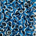 Macro shot of blue translucent Evil Eye loose beads for DIY jewelry and crafts making - Lake Blue / 10mm