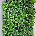 Macro detail of round green striped evil eye resin beads for jewelry making and DIY projects - Light Green / 10mm