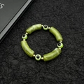 Turkish Evil Eye beaded bracelet with green marble cylinders and gold-tone spacers - Green