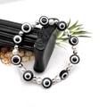 Bracciale elastico con perline occhio del diavolo nero e perle bianche con distanziatori - Nero