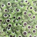 Detailed macro view of light green translucent Evil Eye flat beads for DIY jewelry making - 50 Pieces/Pack (8mm) / Light Green