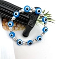 Bracciale occhio greco con perline blu, perle bianche e distanziatori argentati - Blu lago