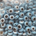 Macro detail of bulk light blue Evil Eye flat beads for DIY jewelry making and crafts - 50 Pieces/Pack (8mm) / Lake Blue