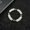 Golden Evil Eye beaded bracelet with acrylic white tubes on black background - White Marble Pattern (Style 1) / White