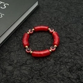 Evil Eye beaded bracelet with red marble resin tubes and golden accents on black background - Red Marble Pattern (Style 2) / Red