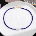 Dunkelblaue Perlenkette mit Barockperlenanhänger und goldener Verlängerungskette - Saphirblau