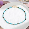 Dettaglio collana di perle in pietra colorata con perle turchesi e chiusura a moschettone - Turchese Blu Cielo (Stile F)