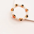 Bracelet perles œil turc de style bohème avec perles blanches et intercalaires dorés chic - Orange