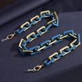 Colorful acrylic eyewear chain with blue and gold interlocking squares and lobster clasps - Color Two