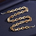 Detail view of colorful acrylic glasses chain with gold UV plating and metal lobster clasps - Beige Amber Splicing Style