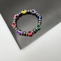 Elastisches Hämatit-Perlenarmband mit bunten Evil Eye Glasperlen und silbernen Zwischenstücken - bunt