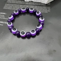 Purple Evil Eye beaded bracelet featuring polished round stones on a stylized card background - 10mm / Purple (11)