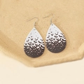 Detailed view of Halloween teardrop earrings with black bat patterns on white faux leather - Style F