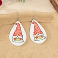 Detail of wooden teardrop earrings with Christmas gnome and Joy sign on a festive tray - Christmas Gnome with JOY Sign Style (4)