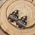 Macro detail of teardrop wooden earrings featuring snowman and Merry Christmas print - New Year Snowman Style (2)