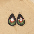 Detail of wooden teardrop earrings with Santa Claus print and green wreath design - Santa Claus Wreath Style (5)